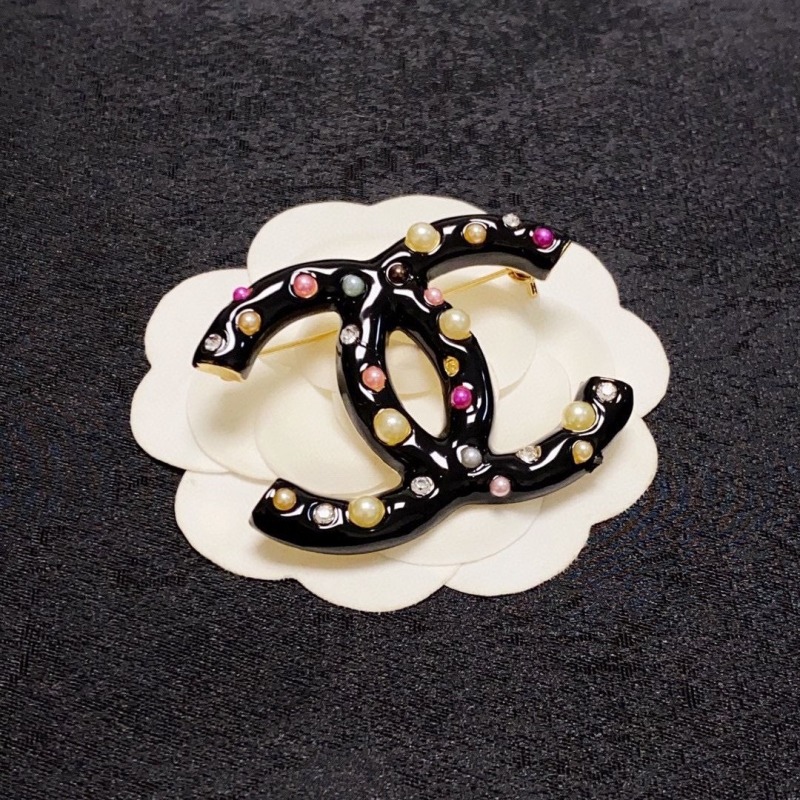 Ch**el brooches